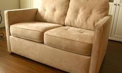 Easy to care for microfibre matching couch and love seat, champagne color.  Classic style and color will go with just about anything. Excellent condition - only 2 years old. Purchased new, this made in Canada set sold for over $3,000.  Asking price of