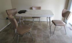 This is an original arborite table with a leaf (not shown) and 4 original chairs. $400 Excellent condition