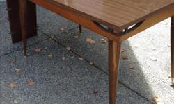 Mid century dining table. Good condition. Approx. 52x35" also has one 12" leaf.
$45