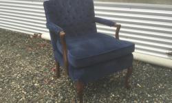 This chair was in my parents home from the late 1960's! It was re- upholstered a few years back and actually is in excellent condition. The fabric is a dark royal blue velvet. This would make a very swanky boudoir chair.