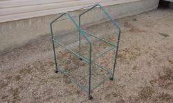 Hot House on wheels
Clear plastic zippered cover included.
27" X 18" X 37" hi.
$10.00
2 tomato cages - paid $9 used one year
$2.00