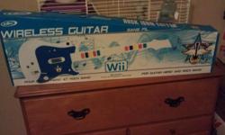 White wii guitar in mint condition. asking 40 or best offer. Not even a year old. Also works with rock band.