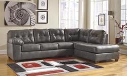 This contemporary sectional is both stylish and extremely comfortable! Only selling as I am moving to a smaller place and no longer have room for it. It was purchased from Ashley furniture about a year and a half ago and is made from their unique