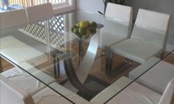 Modern square "tangent" dining table by Elite Manufacturing bought at ScanDesign. Bought for $2300, asking $1300. 5x5. Seats 8 comfortably, in immaculate condition. A real showstopper of timeless glass and wenge.