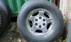Near new tires on aluminum wheels with Chevy center cap. Fits Chev 1/2 ton and SUV, Toyota.
Phone and leave message, text or email.