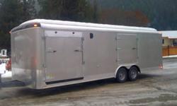 Take a scenic 2 hour drive and save big!!
This unit is equipped to haul a car and a motorcycle. It comes with a rear ramp door, side ramp door, and an escape hatch. It has a finished ceiling, side flow vents and 6" checker plate down the sides. This is a