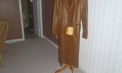 leather coat 100 % natural markings and slight shading on the skin enhances the natural look of the leather from CHAMPS ELYSEE FASHION $60 SIZE 16.OR BEST OFFER CALL 519 471 0651