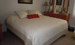 For Sale:  One King's Dreamer, king size mattress with platform bed.  Two drawers on side for storage with removable panel in front for more storage. 
Just purchased in October.  Moving and no room for bed.  Paid $1437.00.  Asking $1000.00 and will