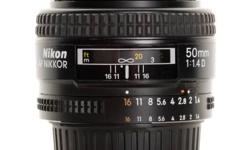 The Nikon 50mm f/1.4 is a secret weapon for low-light photography. Far more important than a fast ISO speed is the ability to gather light, which this lens does extremely well. I am the only owner and have babied it from day one.
If you are ready to take