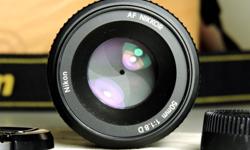 Very nice little prime lens - the "nifty fifty" - for gorgeous bokeh and shallow depth of field. Beautiful portrait lens. The first additional lens you should buy. This particular lens is used, but it hardly shows. The glass is undamaged and crystal