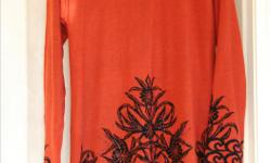 Pretty fall dress with embellished hemline and scroll/flower black print. Heaviler weight dress made of 66% acrylic/34% viscose. Gorgeous orange hue. As new - with tag. Size XL. Can arrange pick-up in Victoria or Westshore.