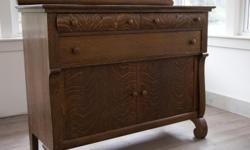 Quarter-sawn (tiger) oak sideboard. Small stain on top.
48" wide, 38" high, 21" deep