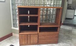 16 inches deep, 55 inches wide and 52 inches high oak unit with two cupboards and two drawers.