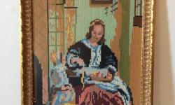 OLD HAND EMBROIDERED CROSS STITCH PICTURE OF A VICTORIAN LADY WITH SEWING OR PERHAPS LACE WEAVING ON HER LAP AND AN OBSERVING CHILD COMPANION, MEASURES 11 1/2 INCHES WIDE BY 15 1/2 INCHES HIGH, BEAUTIFULLY GILDED FRAME IS DATED 1978 ON THE BACK, IN