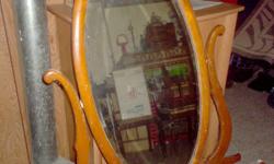 I have For Sale an Oval Mirror for a Dresser . Not sure how old it is .It is old. It does have a number on the back not sure if that is the year . The number is 1922 Asking 30.00