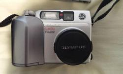 OLYMPUS C-4000 Zoom Digital Camera
4.0 megapixel sensor, 3x Optical plus digital zoom lens with auto focus
Also included, Olympus camera case with strap, 32 mb smart media card, lens cap,
4 lithium batteries (also accepts NiMH rechargeable batteries.