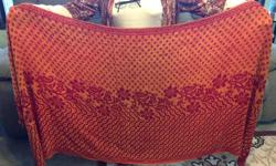 Nice orange and yellow shawl which can be worn with either side on the outside. Nice pattern.