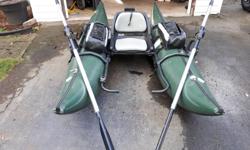 9 ft outcast pontoon boat with anchor system and rope, has a electric motor mount, checker plate on the back if you want to put a battery for elect. motor . 7 ft oars with oar rights. Great for rivers or lakes for one person
