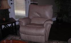pair of swivel/recliner leather chairs in putty/tan color. very good condition.