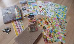 Lots of scrapbooking stickers, old style photo corners, empty book for journal or scrapbook and Paper Crafts book.
The Paper Crafts book has tons of great ideas for making things from paper for parties, decor or with the kids. Brand new condition - could