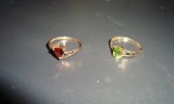 Peridot ring, oval cut stone, stamped 10K, yellow gold, dainty.  Approx. size 7.  $60. OBO.
Garnet ring, triangle cut stone, stamped 10K, yellow gold, dainty.  Approx. size 7.  $60. OBO.
Located in Salmo.