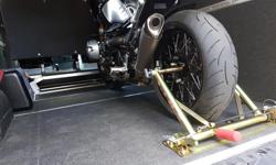 Best way to transport your bike. No pressure on fork seals from tie downs. Currently setup for BMW R9T. check restrictions here
https://www.pit-bull.com/motorcycle-trailer-restraints/bmw-trailer-restraints?product_id=1013
Paid $650 CAD including shipping