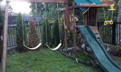 Playground with swings, wood needs to be cleaned up and re-stained, but is safe and in ok condition.
