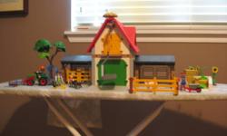 These two sets retail for $144 including taxes.  They are one year old and rarely used as they have been at Grandma's house.  The hay can be winched up to the hay loft.  The tractor can drive around the farm.  Sorry for the blurry photos.
Great for