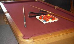 We have a connely pool table for sale. It comes with 6 cue sticks, set of 8 balls, set of snooker balls, and 3 balls setters. This table has a 3/4 inch slate, cranberry cloth and is 3 years old.