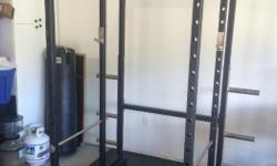 This is full sized squat rack with plate holders. A squat rack of this size starts at $1000 retail. I have added a monkey pull up bar to it as well. Retails $170. The rack is bolted to 4x4's now for added height. I'm 6'2" and can over head press inside.