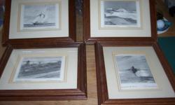set of 4 prints mounted in a frame of 1) Bluenose, 2) Peggy's Cove, 3) Citadel Hill, and 4) fisherman hauling in his net