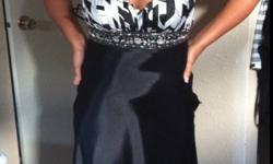 Black and white silk fabric, size 6, halter top, with opalescent beading around bust, open back. Long terrain. Needs to be worn to be appreciated. Stunning prom dress.
This ad was posted with the Kijiji Classifieds app.