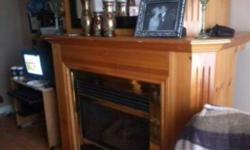 Pine propane fireplace cabinet, marble base, with mantel! Item is too big for the living room!