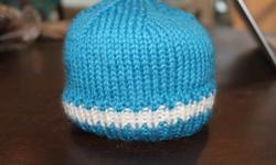 Just knit, brand new item, perfect to keep that brand new little head warm in the cold and damp.