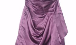 Size 4, short, purple satin, strapless gown with built in bra. Exceptionally well made, worn twice. Lined and beautifully draped fabric, the dress is perfect for graduation, winter grad or new year's or any formal event, weddings, theatre outings... Will