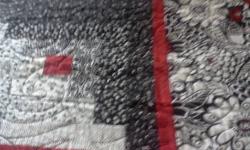 Homemade queensize quilt....100" x 100" approx....black/white/red log cabin design with back of quilt black/white .... professionally quilted by machine...cost $600 to make.