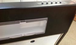 Kenmore 30" Energy Star slim line range hood. Quiet yet with powerful ventilation. Variable speed fan. Includes two fluorescent bulbs. Black color. Unit is clean and in as new condition. Sears price for a new one is $450 .00. The only reason we are