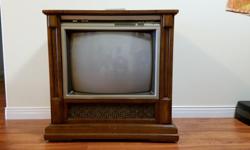 This is a console TV. It is in good working order though the cabinet has a few stains and scratches. It is on wheels so it is easy to move around. we have invested in a flat screen TV so it is now surplus to our needs. We would like to find it a new home.