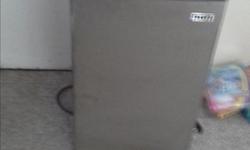 32 cu.ft. mini fridge with small freezer. Almost new but has small dent on front door