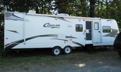 34',2009 Cougar, polar package,2 slides,queen bed,single bedroom in the back MAKE AN OFFER,IT NEEDS TO GO