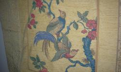 Made in France, 100% cotton quilted, 28" by 28", 3 tasels, depicts 2 birds in branches.