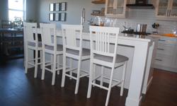 Beautifully refinished counter height stools with fabric seats.
The stools are painted in antique white melamine paint which is very hard wearing. The seats have been re-upholstered with a soft grey fabric which would go with any decor.
Height to the top