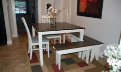 Beautifully refinished square table complete with 2 chairs and 2 benches which can be arranged to make a corner seating arrangement. The table has been painted in antique white melamine paint which is very hard wearing and the top is stained in