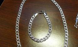 A Rhodium Plated Silver Chain and Bracelet - New never worn
purchased from Greenwich Jewellery - Comes with lifetime guarentee
 
The Chain is approx. 20 inches long with an added extension of 3 inches to make it 23 inches long.
 
The bracelet is approx. 8