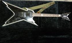 Right hand Dean Dime Razorback electric guitar with hard case, inventory #134778-17. Features Seymour Duncan Dimebucker bridge pickup and DMT design neck pickup. Does have a small chip on head. Price of $899 includes all taxes. PLEASE REFER TO INVENTORY