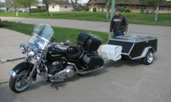 2011 Roadman motorcycle camper trailer
 Weighs only 200lbs
 all alluminum c/w 12"alluminum rim low profile tires
 sets up in minutes
 -only 1200miles on it
 folds out to queen size bed
 don't even notice it behind bike
 very well balanced and only puts