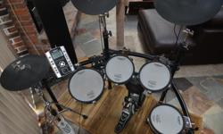 4 drums, bass drum with custom TAMA pedal, 2 digital cymbals + digital hi-hat..throne included. 2 yrs old. Very responsive heads.