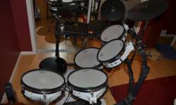 Beautiful Roland TD10 with TDW1 expansion module with V-cymbal control, includes 5 mesh head drums, Roland stand, 3 cymbals and all hardware to go, with extra Roland pads. Well cared for, excellent value. Priced to sell.