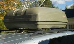 I have a solid sided roof top box that I no longer use. All mounting hardware is included. The cover locks down, I have keys. Have driven in heavy rain and never had any water inside. Need to get this out of my garage, make me an offer. This roof box can