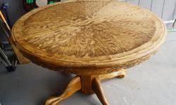 Beautiful Antique ROUND Golden OAK Dining table with a 2 foot Leaf
Recently refinished, excellent condition
Seats 6 without leaf and 8 with the leaf
Very solid construction
This table could also be used a patio table under a covered deck
Four chairs also